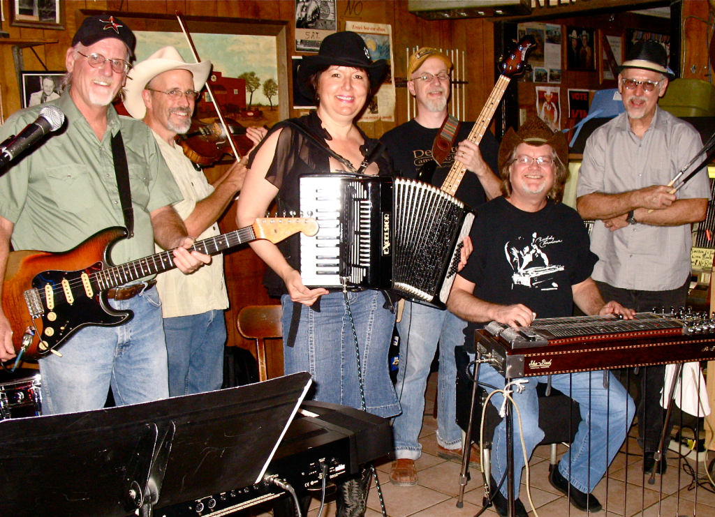 Debra Peters playing accordion with the Love Saints band at the Broken Spoke in Austin, Texas – 2010