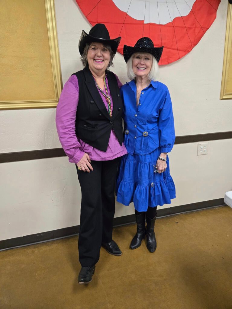 Debra Peters with accordionist Sylvia Jorgensen dressed up to perform for Fat Tuesday celebration at Arizona Accordion Club