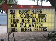 Broken Spoke dancehall marquee in Austin, Texas listing Debra Peters alongside Bobby Flores, Cornell Hurd, Jesse Dayton, and Dale Watson