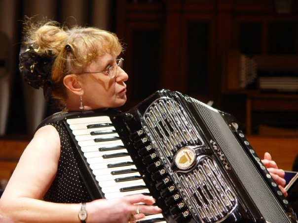 Mary Tokarski playing accordion – treasured ATG friend & orchestra lead