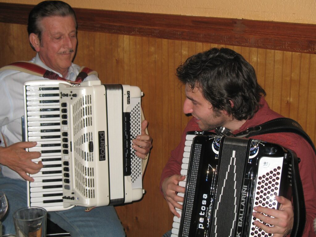 Paul Betken and Cory Pesaturo playing accordions together