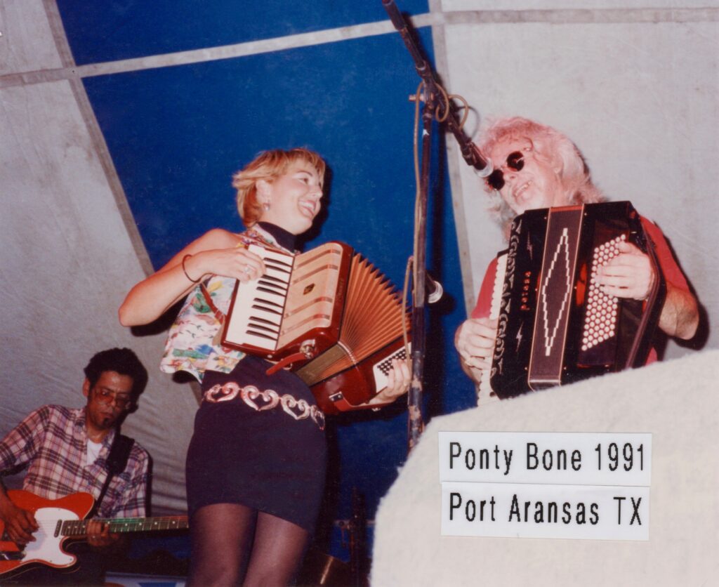 Debra Peters playing accordion cajun-fest with Ponty Bone & The Squeezetones at Port Aransas, Texas in 1991