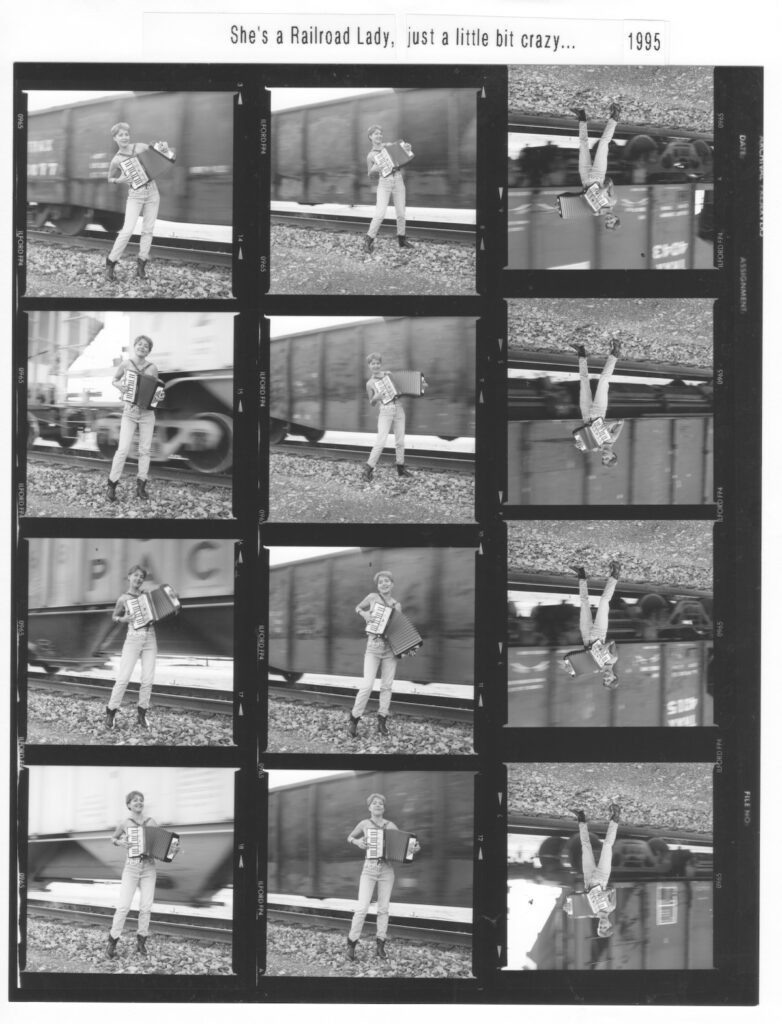 Debra Peters Railroad Lady accordion photo shoot 1995 on train tracks