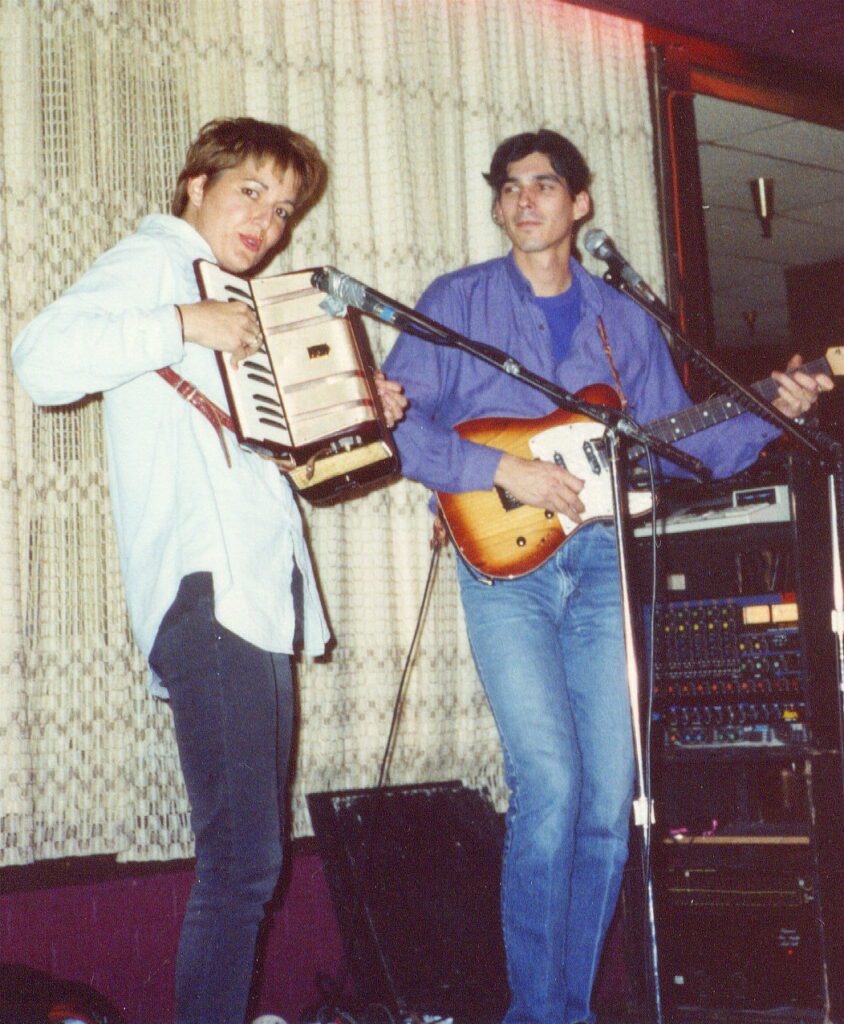 Debra Peters on accordion with guitarist Tony Prophet performing together